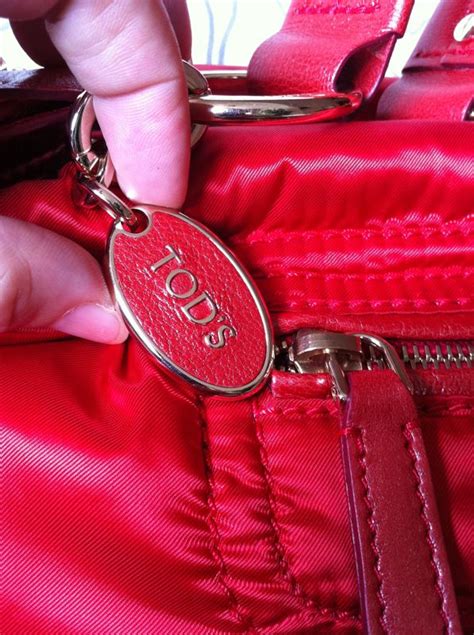 how to tell a fake tods bag|are tods bags real.